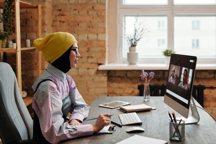 woman at desk on video call